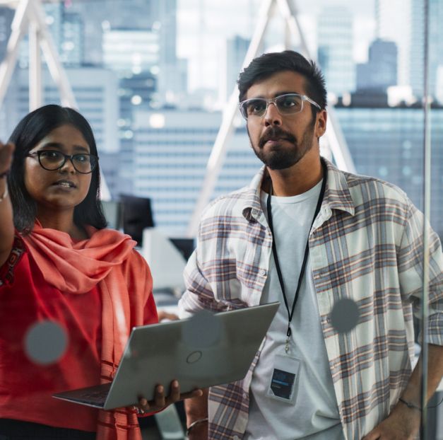Man and woman in conversation with laptop